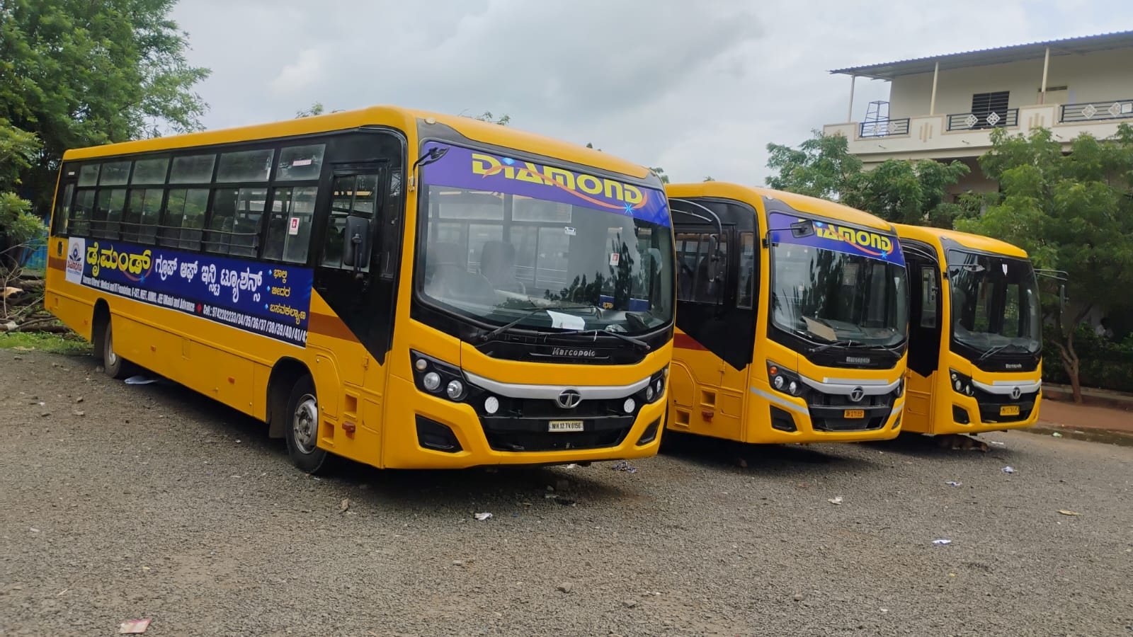 Diamond buses lined up for the morning routes at the Bhalki campus